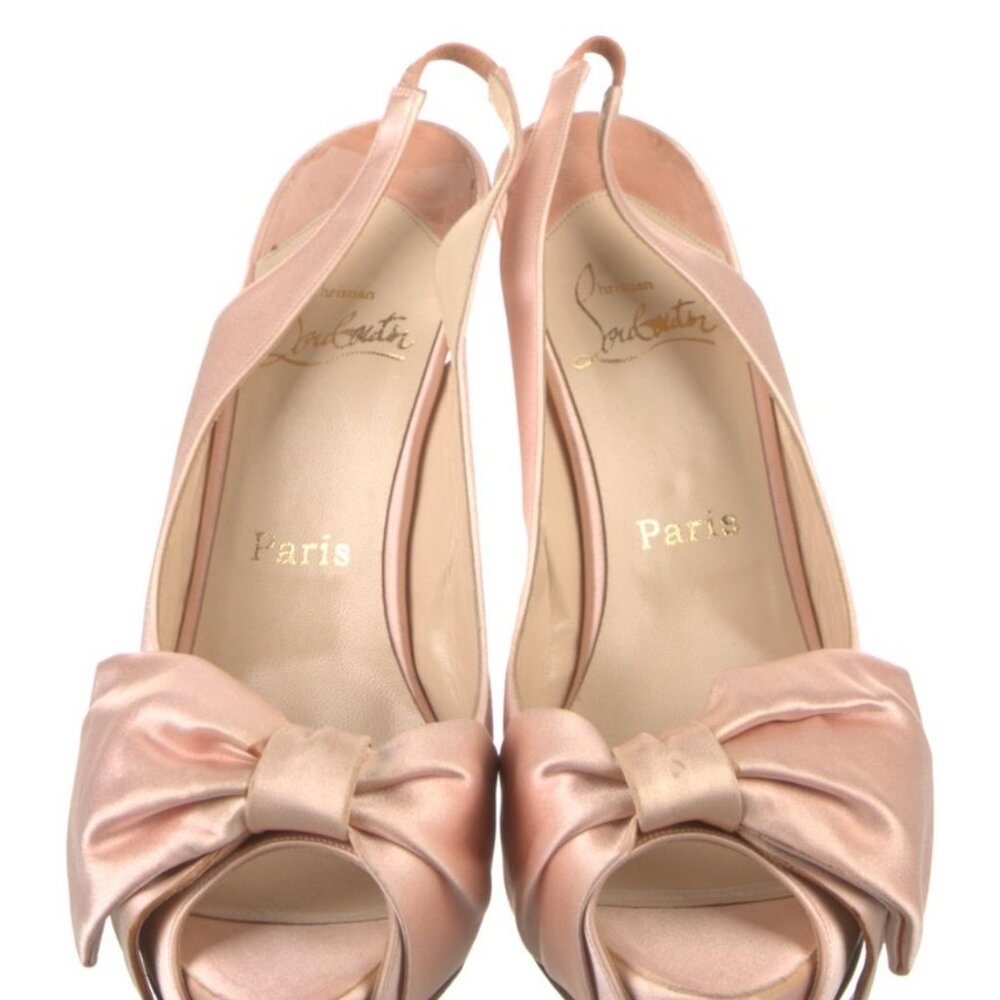 CHRISTIAN LOUBOUTIN Pink Satin Bow Accents Slingback pumps with hidden platform